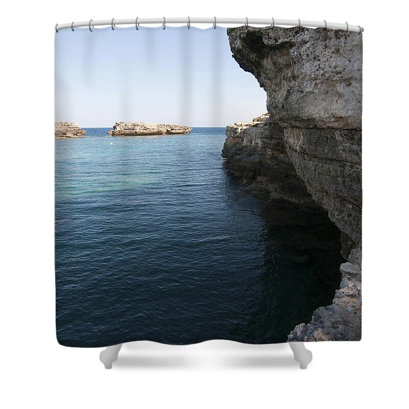 20-24 Shower Curtain featuring the photograph Minorca south coast rocks in Alcafar beach rounded with a turquoise mediterranean sea - White rocks by Pedro Cardona Llambias