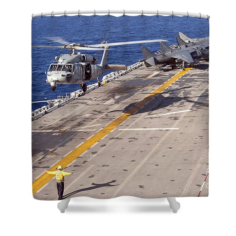 Underway Replenishment Shower Curtain featuring the photograph An Mh-60s Seahawk Helicopter Prepares by Stocktrek Images