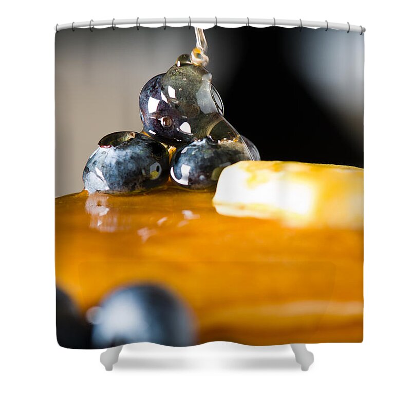 Berries Shower Curtain featuring the photograph Blueberry butter pancake with honey maple sirup flowing down by U Schade