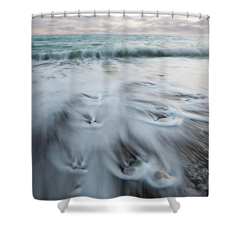 Coastline Shower Curtain featuring the photograph Pebbles in the beach and flowing sea water by Michalakis Ppalis
