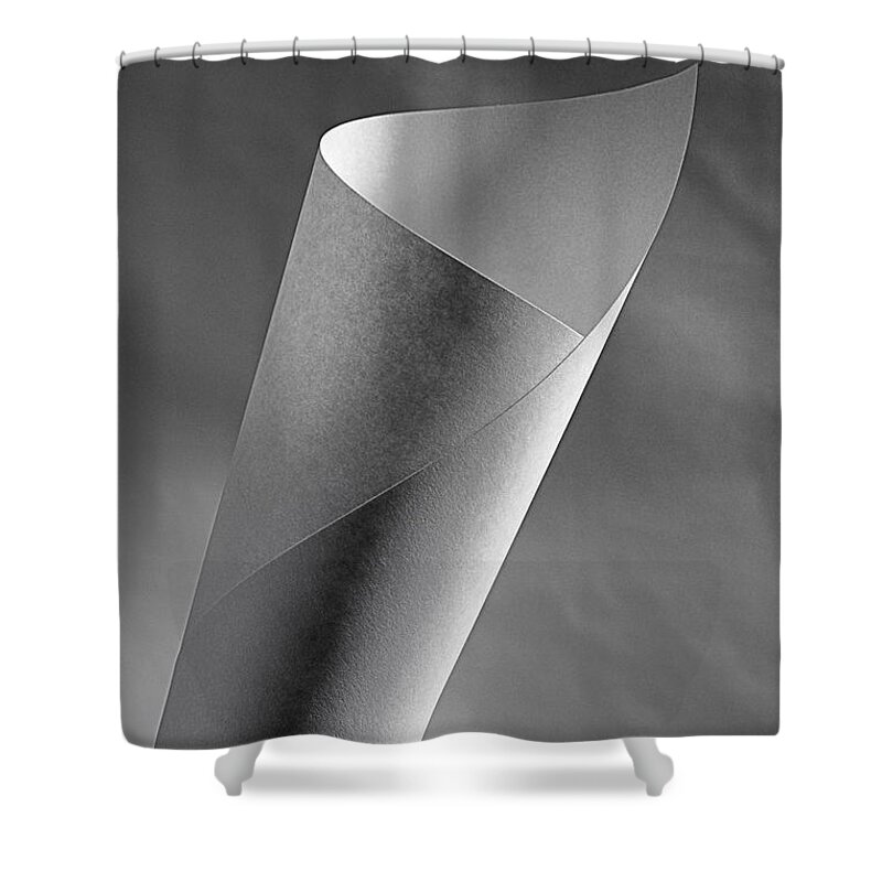 Black White Monochrome Paper Light Lighting Abstract Paper Spiral Twist Spin Wrap Still Life Studio Shower Curtain featuring the photograph A Paper in Spiral by Ken DePue