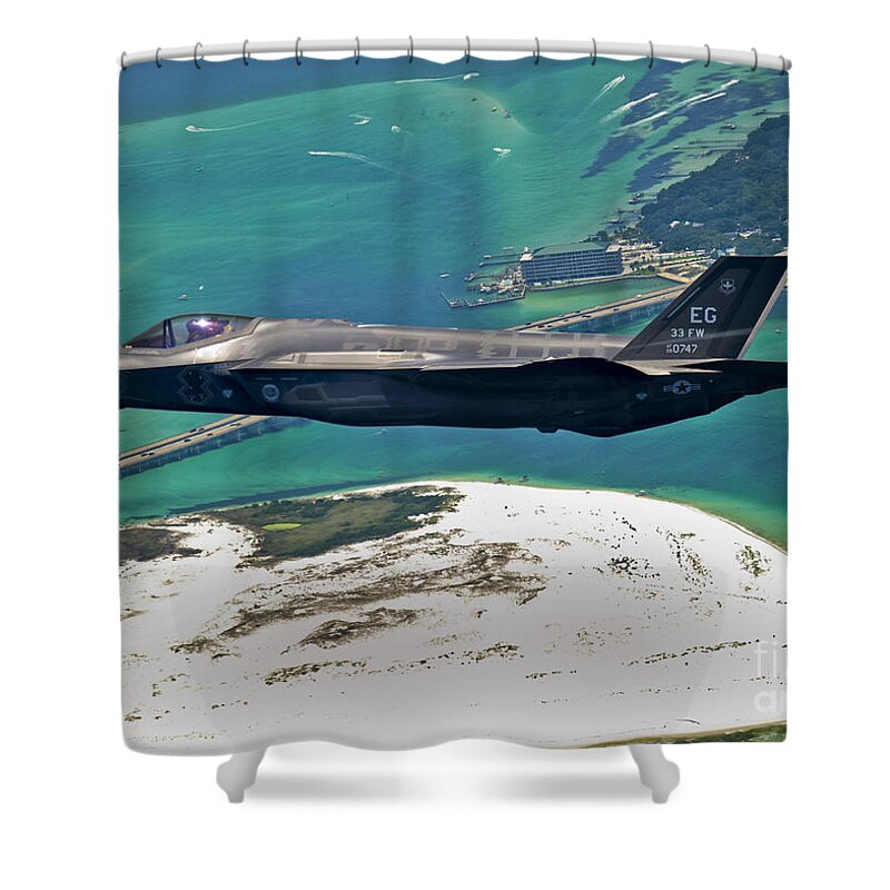 Stealth Shower Curtain featuring the photograph An F-35 Lightning II Flies Over Destin by Stocktrek Images