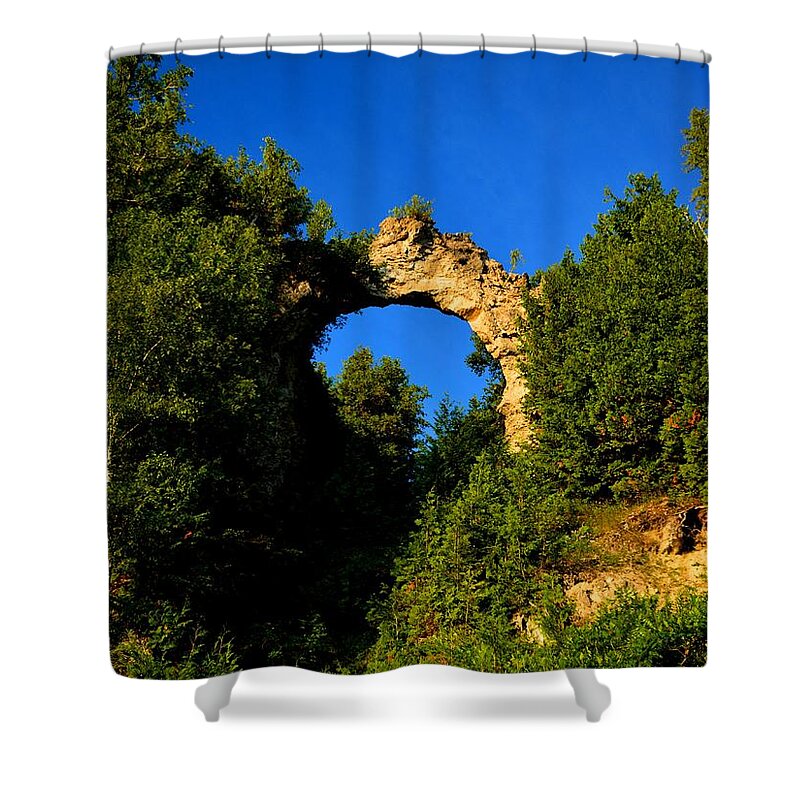 Mackinac Island Shower Curtain featuring the photograph Beneath Arch Rock by Keith Stokes