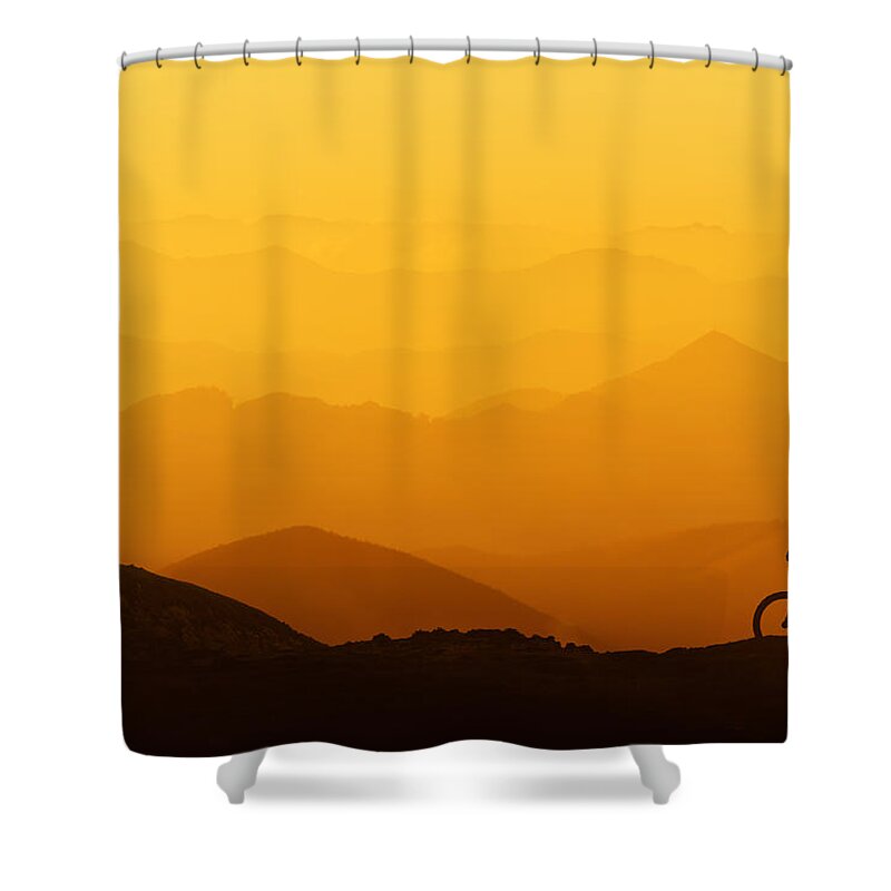 Biker Shower Curtain featuring the photograph Biker Riding On Mountain Silhouettes Background by Mikel Martinez de Osaba