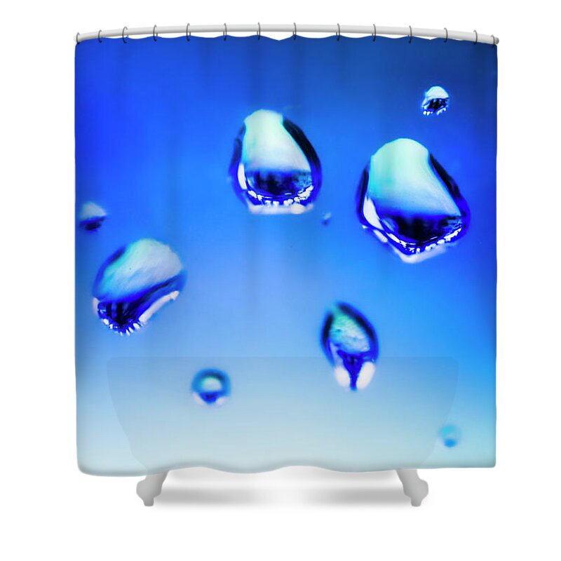 Water Shower Curtain featuring the photograph Blue water droplets on glass by Jorgo Photography