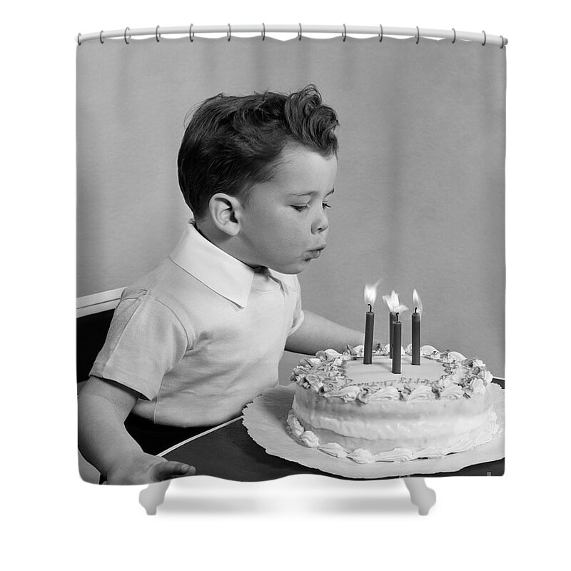 1950s Shower Curtain featuring the photograph Boy Blowing Out Candles On Cake, C.1950s by H. Armstrong Roberts/ClassicStock