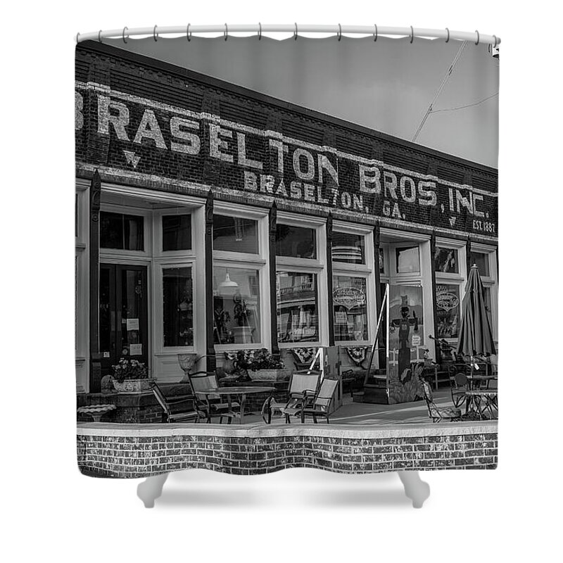 Braselton Shower Curtain featuring the photograph Braselton Bros Inc. Store Front in BW by Doug Camara