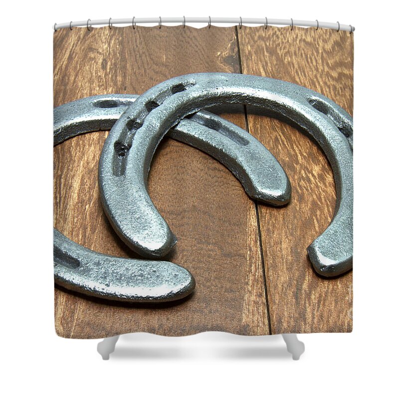 Cast Iron Shower Curtain featuring the photograph Cast Iron Horseshoes on Barn Wood by Karen Foley