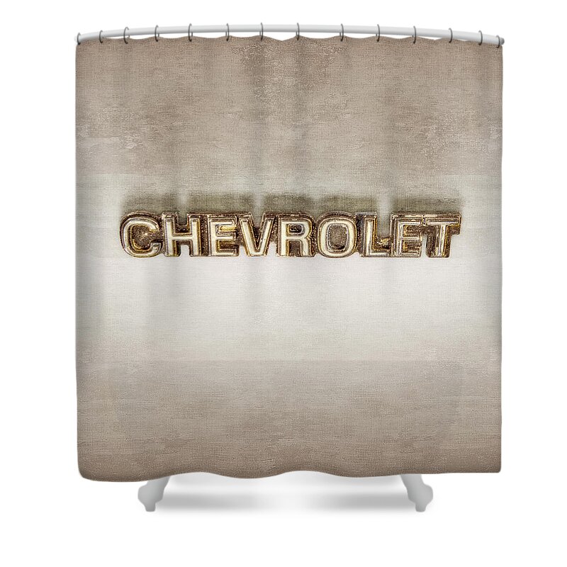 Automotive Shower Curtain featuring the photograph Chevrolet Chrome Emblem by YoPedro