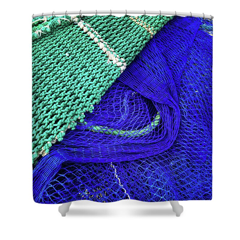 Fishing Shower Curtain featuring the photograph Green and blue fishing nets by GoodMood Art