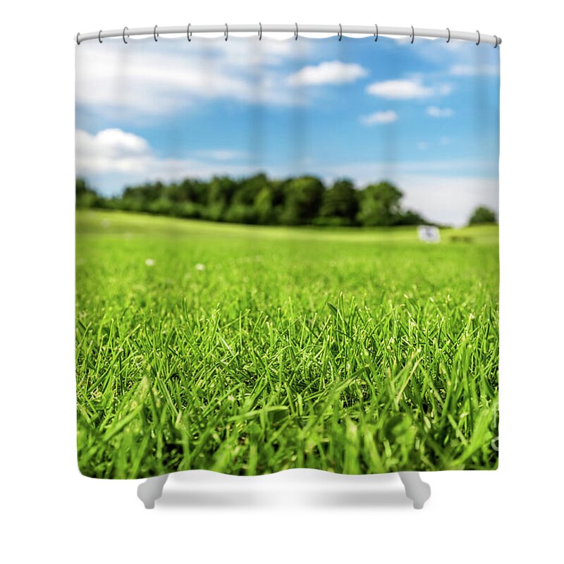Golf Shower Curtain featuring the photograph Green golf course with blue sky. by Michal Bednarek