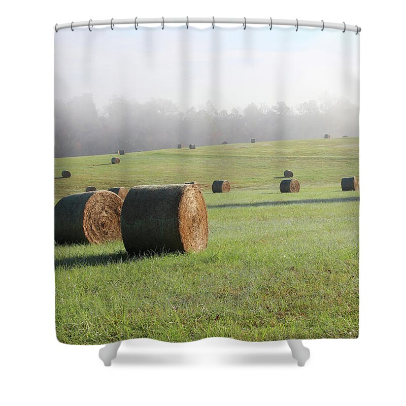 Bale Shower Curtain featuring the photograph Hay Bales in a Missouri field on a sunny and foggy morning by Adam Long