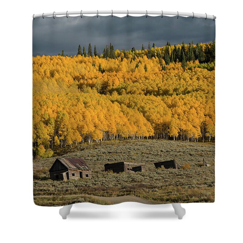 A Blazing Hillside Of Aspen Trees Seems To Stand Guard Above A Collection Of Abandoned Ranch Buildings.  Shower Curtain featuring the photograph Hills Afire by Dana Sohr