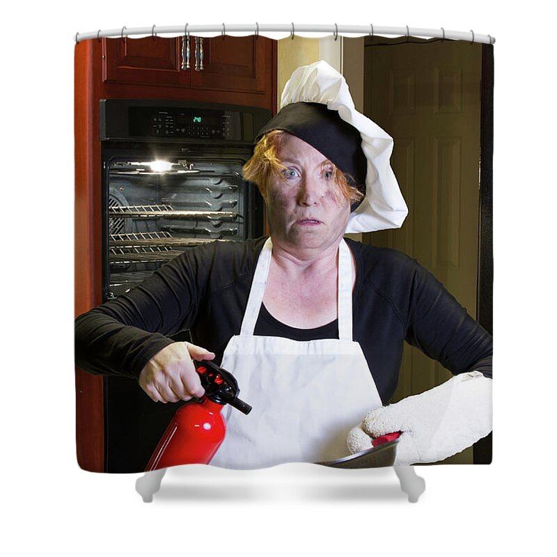 Burning Shower Curtain featuring the photograph Kichen disaster in apron with fire extinguisher and pan by Karen Foley