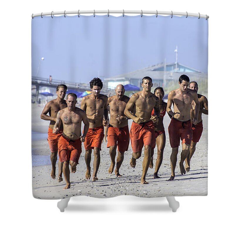 Life Guard Shower Curtain featuring the photograph Kure Beach Life guards on the run by WAZgriffin Digital