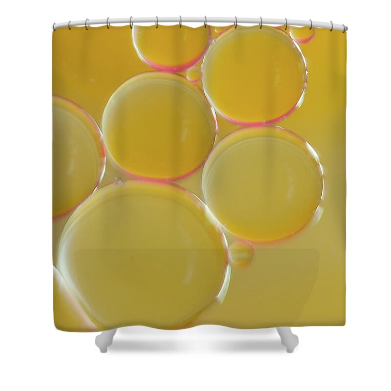 Water Shower Curtain featuring the photograph Oil bubbles on water abstract by Andy Myatt