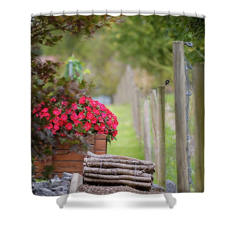 Country Shower Curtain featuring the photograph Red flowerd with Fende and wood billet bundle by Amanda Mohler