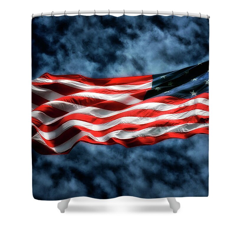 Storm Flag Shower Curtain featuring the photograph Storm Flag Against A Stormy Sky at Fort McHenry by Bill Swartwout