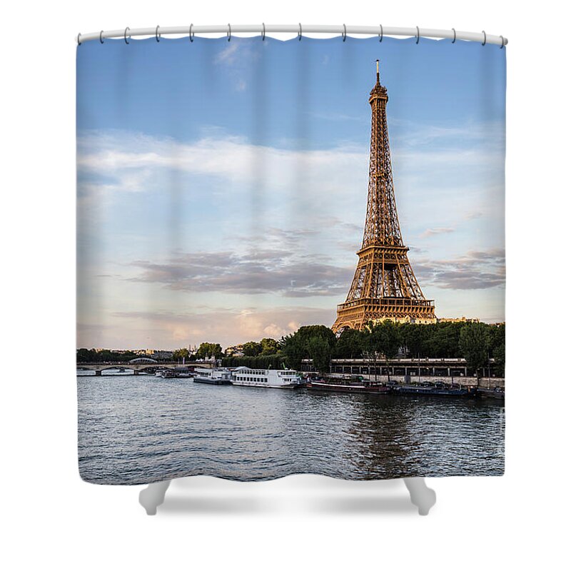 Eiffel Tower Shower Curtain featuring the photograph Sunset over the famous Eiffel tower by the Seine river in Paris, by Didier Marti