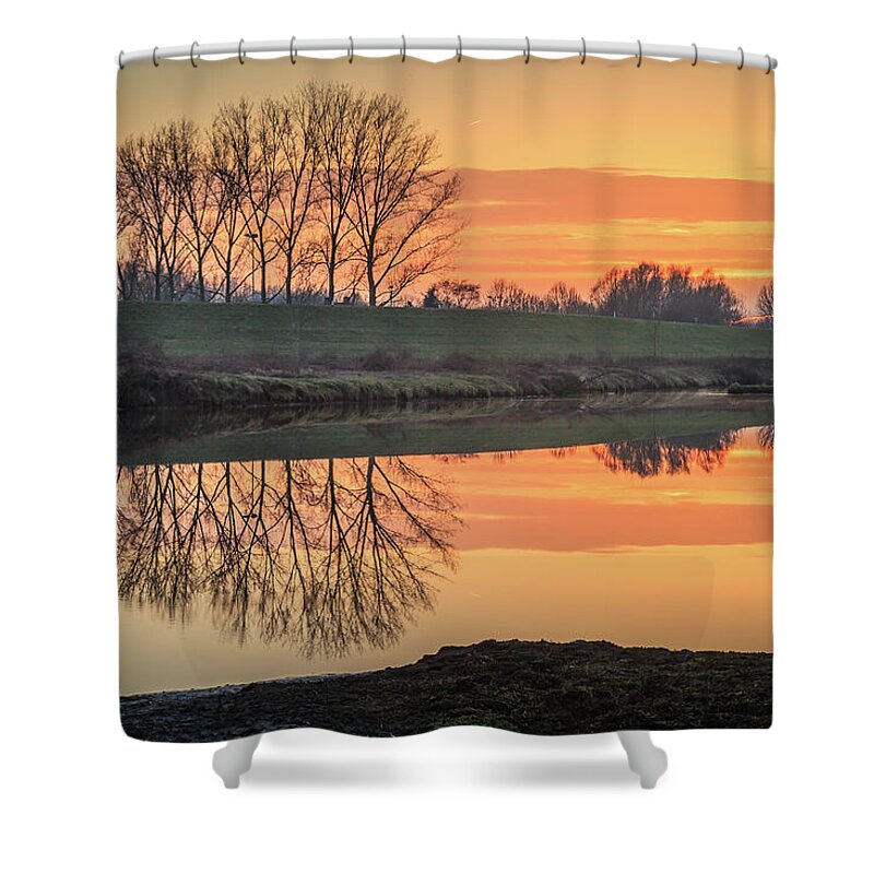 Reflection Shower Curtain featuring the photograph Trees reflection in the water at sunset in Meinerswijk by Tim Abeln