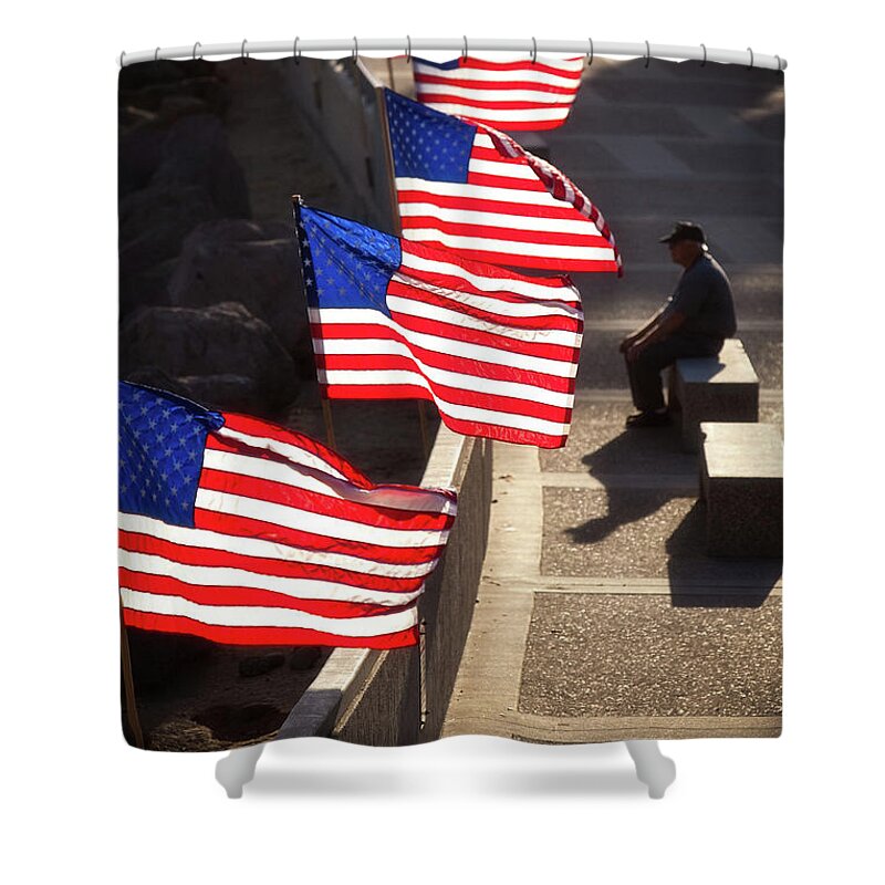In Focus Shower Curtain featuring the photograph Veteran With Our Nations Flags by John A Rodriguez