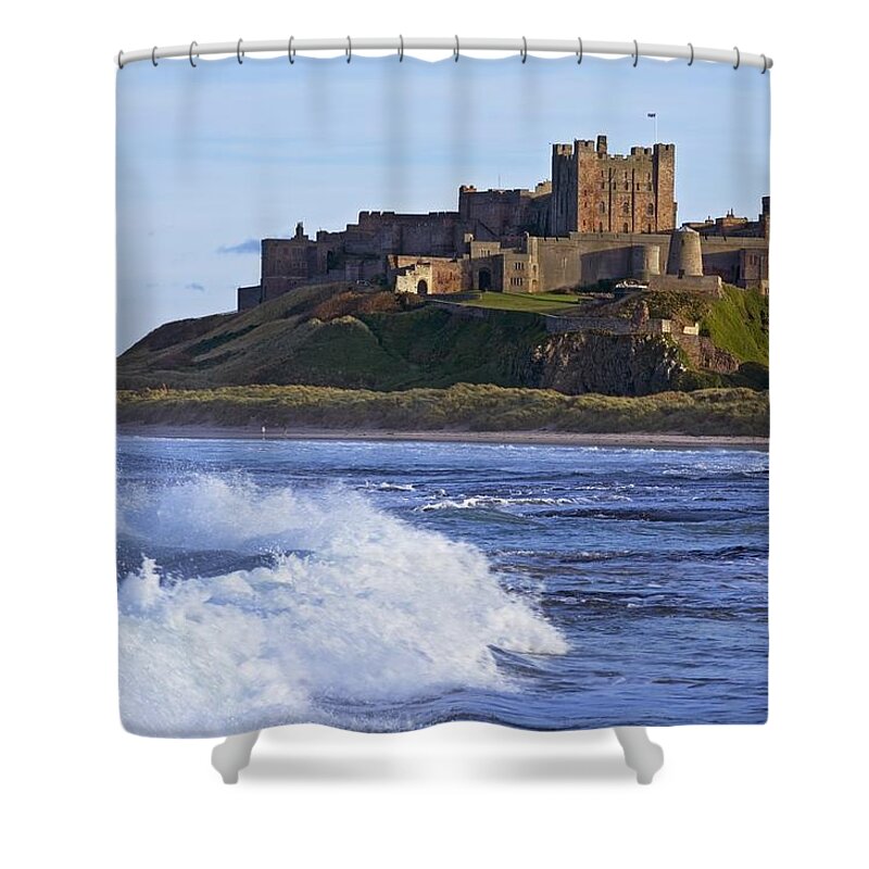Bamburgh Castle Shower Curtain featuring the photograph View From Ocean Of Bamburgh Castle by Axiom Photographic