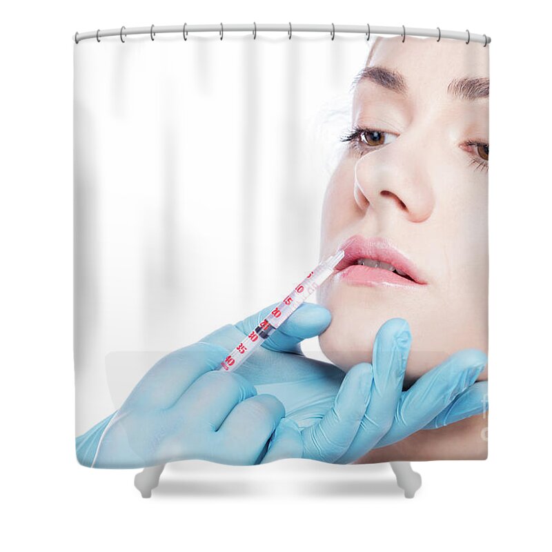 Aesthetic Shower Curtain featuring the photograph Young woman having lip-plumping injections. by Michal Bednarek