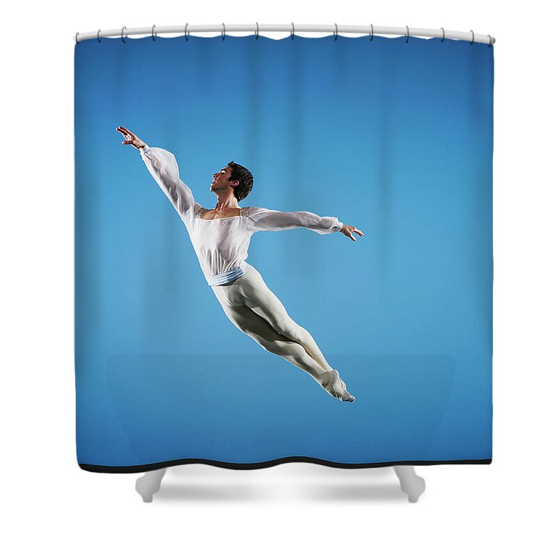 Ballet Dancer Shower Curtain featuring the photograph Male Ballet Dancer Leaping On Stage #1 by Thomas Barwick