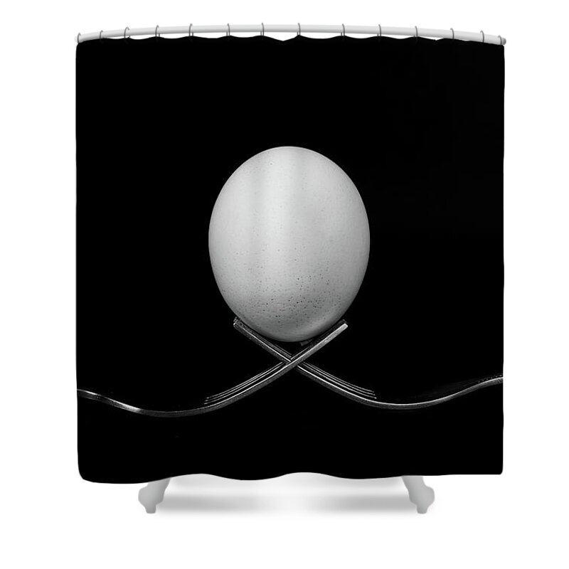 Egg Shower Curtain featuring the photograph White egg resting on two metal and shiny forks on a black backg by Michalakis Ppalis