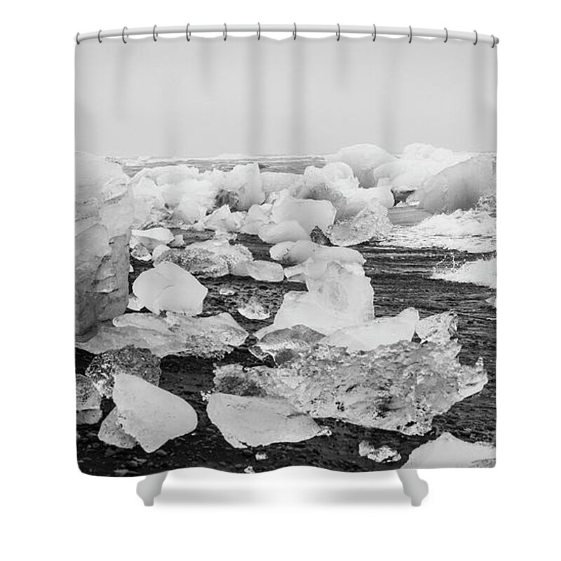 Arctic Shower Curtain featuring the photograph Giant ice blocks detached from icebergs on the coast of an Icelandic beach. #10 by Joaquin Corbalan