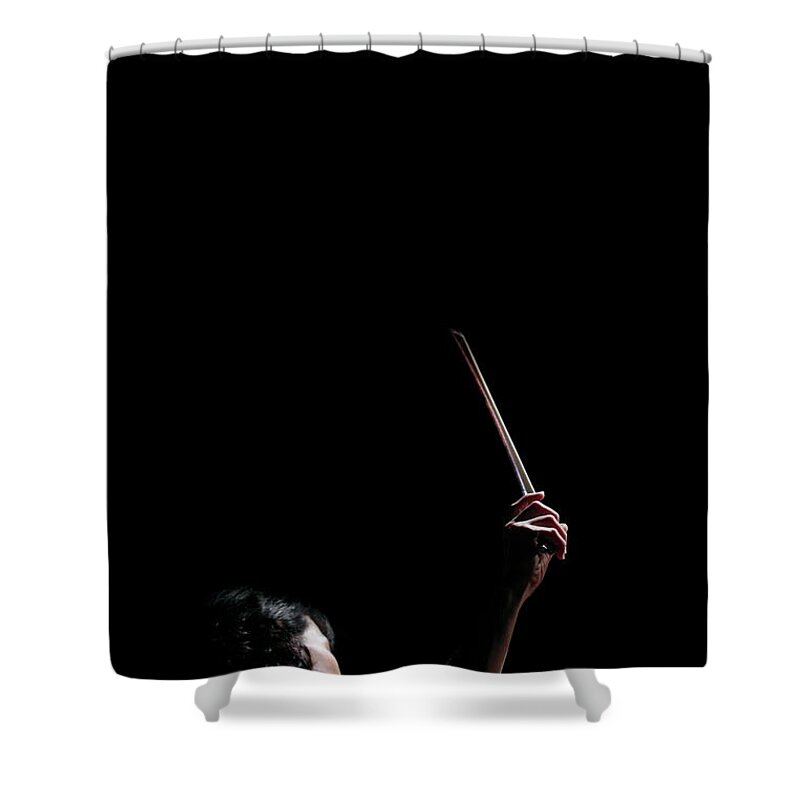 Human Arm Shower Curtain featuring the photograph A Female Cellist Raising Bow Of by Sot