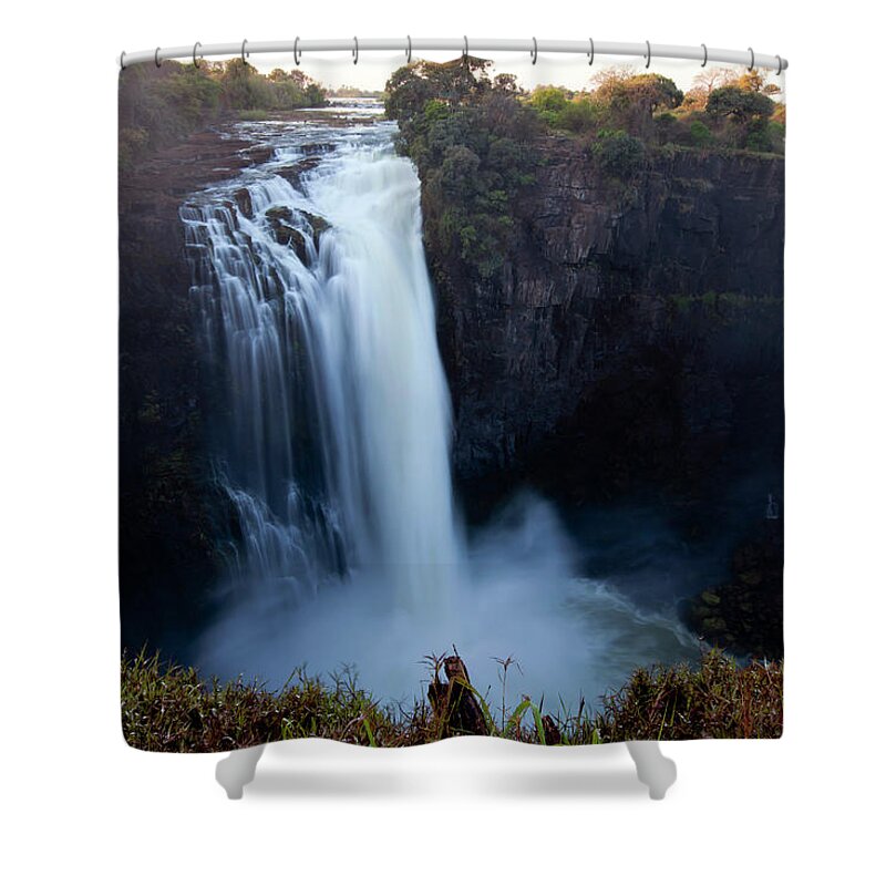 Shadow Shower Curtain featuring the photograph A Long Exposure Of Water Falling Over A by Anthony Grote