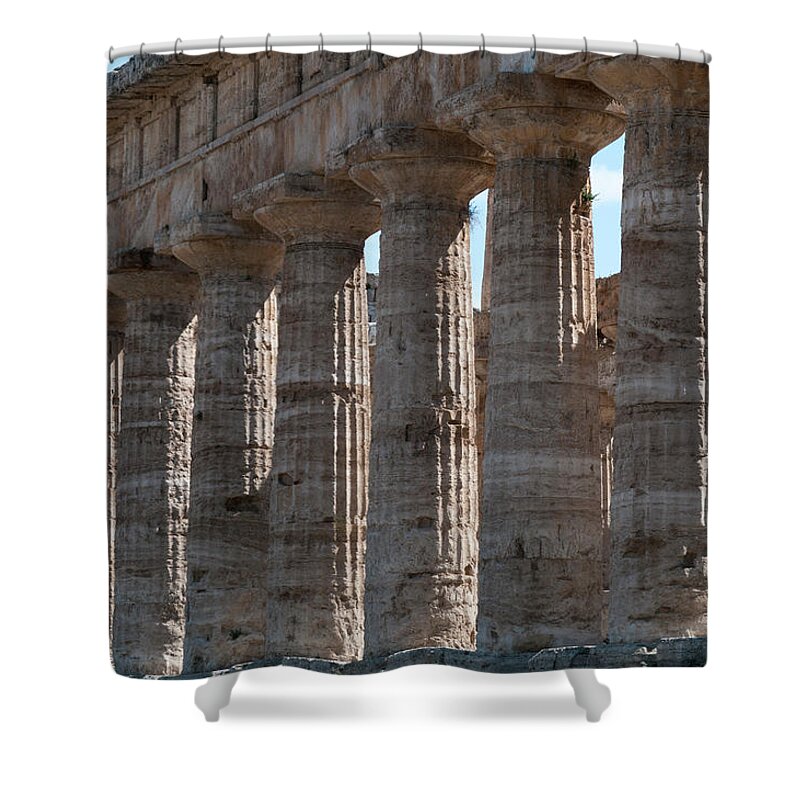 In A Row Shower Curtain featuring the photograph Ancient Greek Columns In Paestum by Stuart Mccall