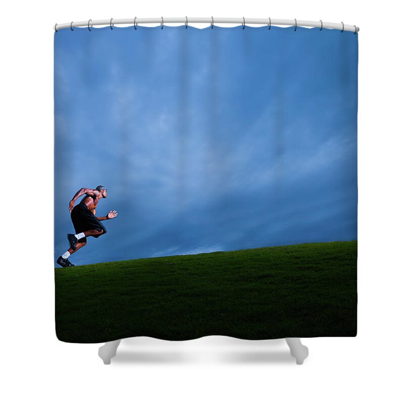Expertise Shower Curtain featuring the photograph Athlete Running Up Grassy Hill by Johnnyhetfield