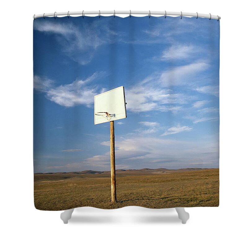 Globalization Shower Curtain featuring the photograph Basketball Backboard And Hoop On Rural by Peter Adams