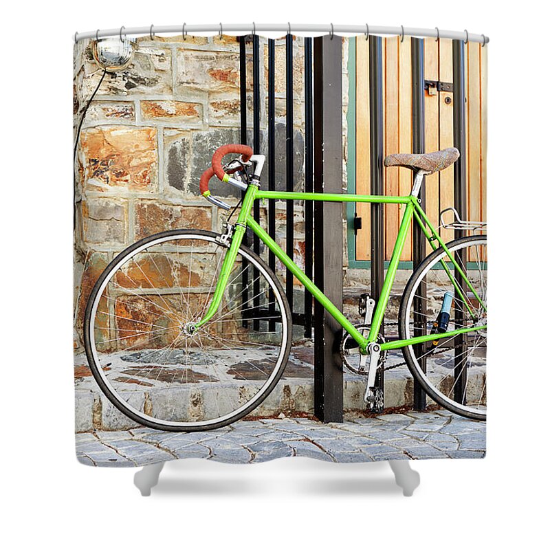 Lifestyles Shower Curtain featuring the photograph Bicycle Leaning Against Metal Gate by Clicknique