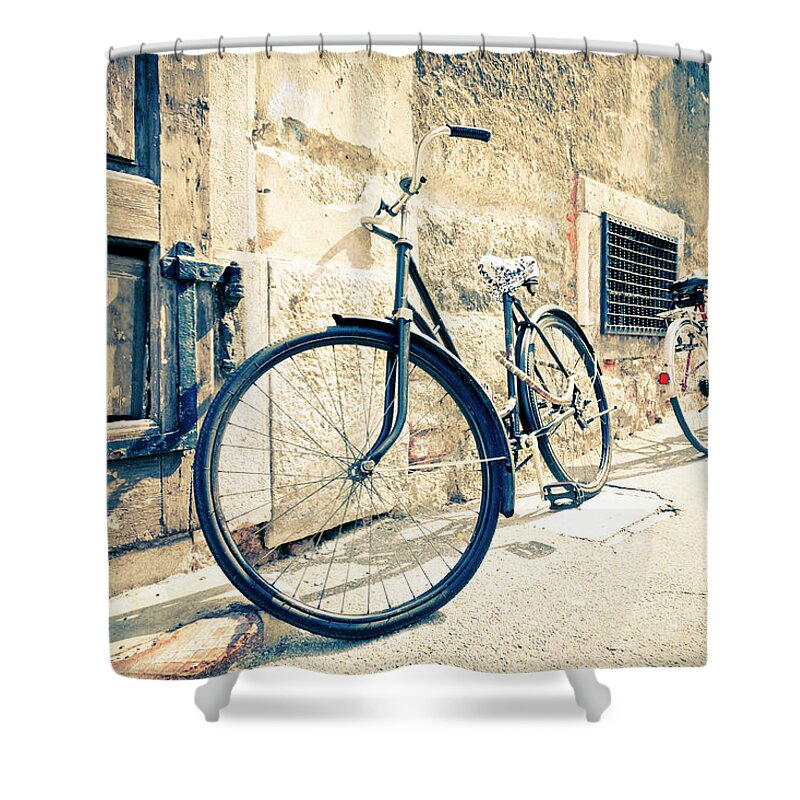 1950-1959 Shower Curtain featuring the photograph Bicycle Leaning Against Wall by Mauro grigollo
