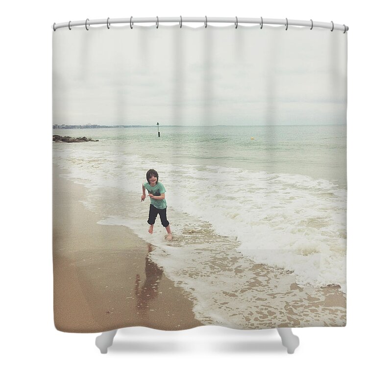 Rolled Up Pants Shower Curtain featuring the photograph Boy Running Out Of Waves, Sandbanks by Jill Tindall