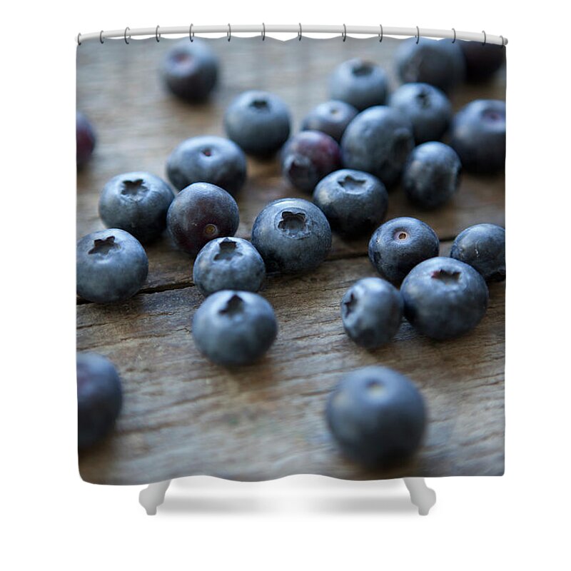 Large Group Of Objects Shower Curtain featuring the photograph Close-up Of Blueberries On Table by Halfdark