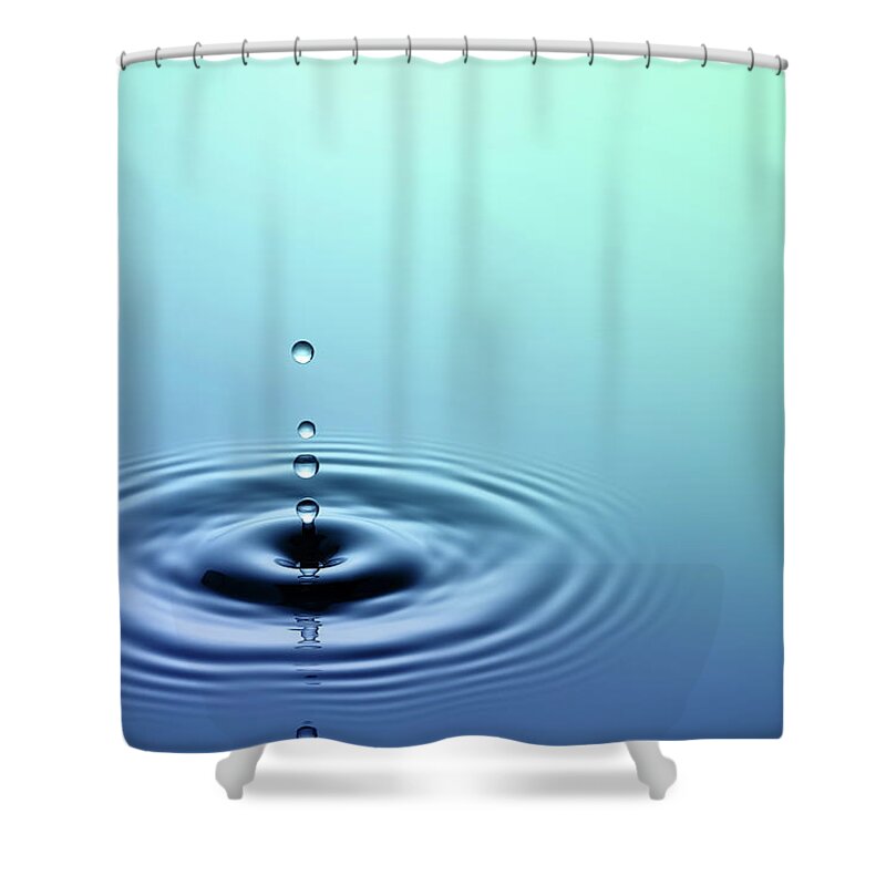 Water Surface Shower Curtain featuring the photograph Close-up Photo Of Water Dripping Into A by Trout55