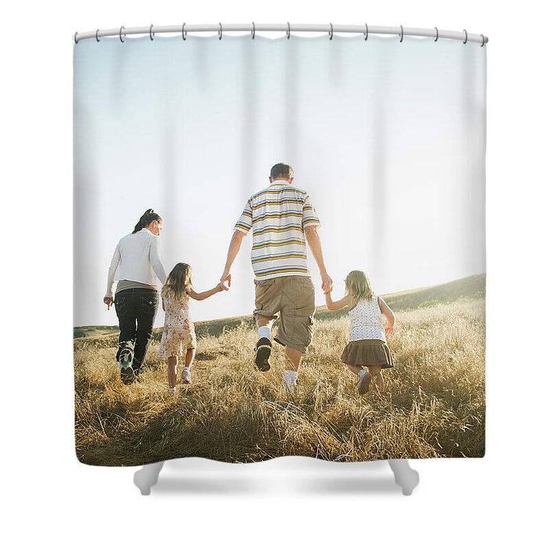 4-5 Years Shower Curtain featuring the photograph Family Walking Together In Rural Field by Erik Isakson