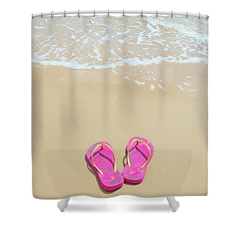 Water's Edge Shower Curtain featuring the photograph Flip Flops On A Sandy Beach by Kathy Collins