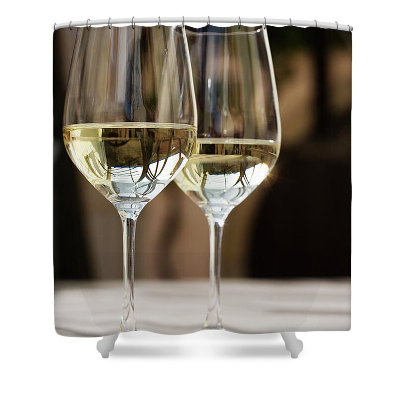 Alcohol Shower Curtain featuring the photograph Glasses Of White Wine On Table by Foodcollection Rf
