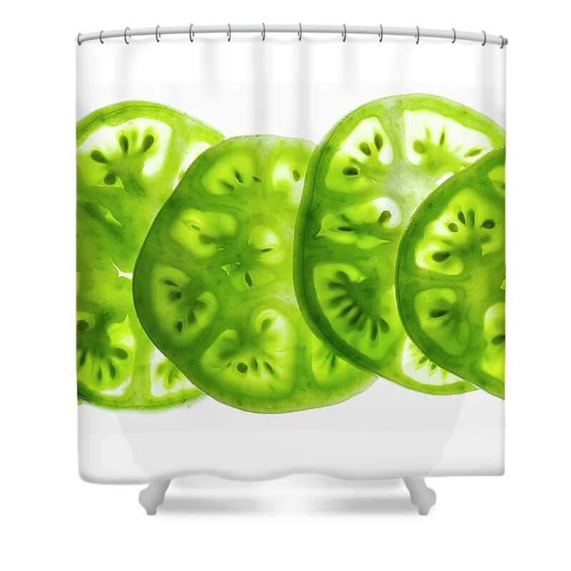 Five Objects Shower Curtain featuring the photograph Green Tomato Slices On A White by Howard Bjornson