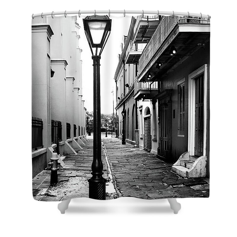 Wooden Post Shower Curtain featuring the photograph Lamp-post In Alley by Kiskamedia