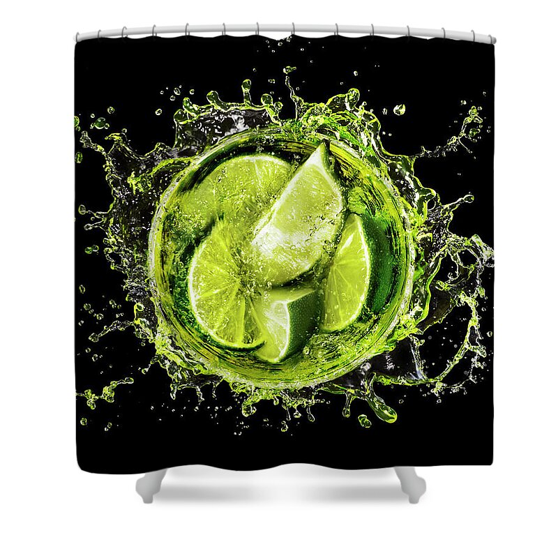 Martini Glass Shower Curtain featuring the photograph Lime Splash Into Cocktail Glass by Stilllifephotographer