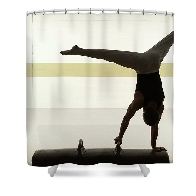 People Shower Curtain featuring the photograph Male Gymnast Performing On Pommel Horse by Romilly Lockyer
