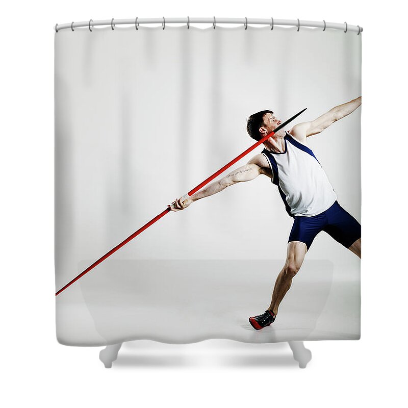 Expertise Shower Curtain featuring the photograph Male Track Athlete Preparing To Throw by Thomas Barwick