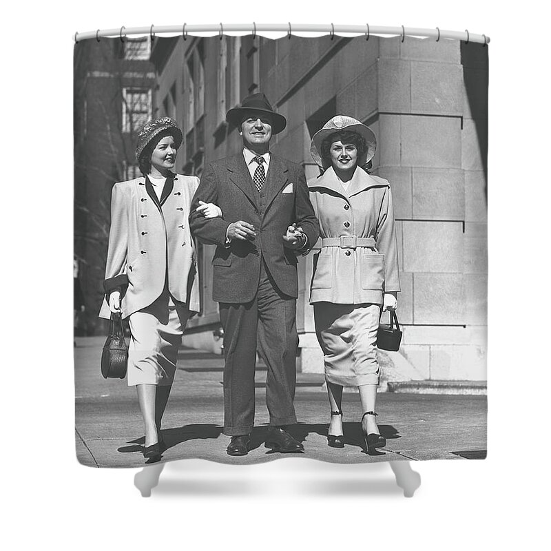 Fedora Shower Curtain featuring the photograph Man And Two Women Walking On Sidewalk by George Marks