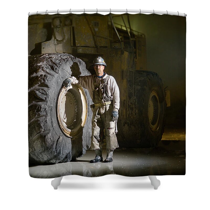 Expertise Shower Curtain featuring the photograph Mining Worker Standing Beside Tyre In by Tyler Stableford